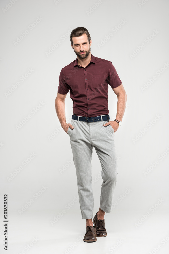 handsome bearded stylish man posing in casual closing, isolated on grey handsome bearded stylish man posing in casual closing, isolated on grey