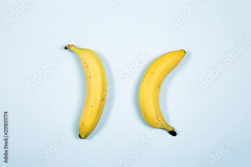 Two banana isolated on color background,view of top,flatlay style