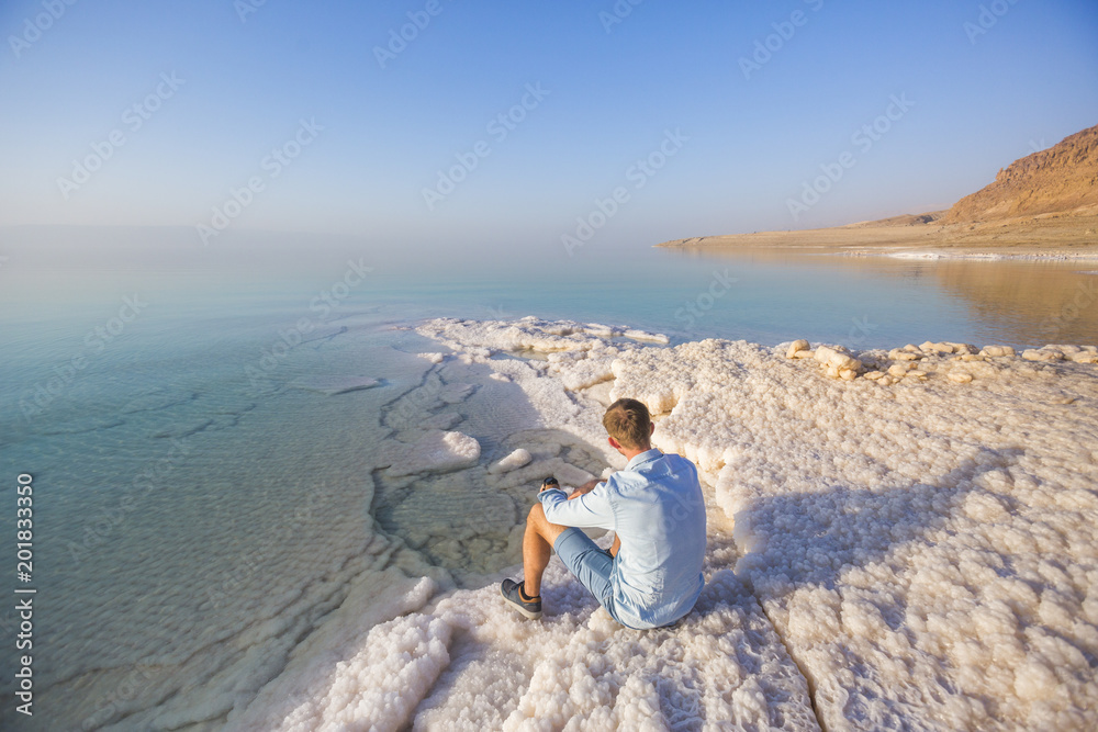 Ttourist on shore of Dead Dea. Jordan landscape Ttourist on shore of Dead Dea. Jordan landscape