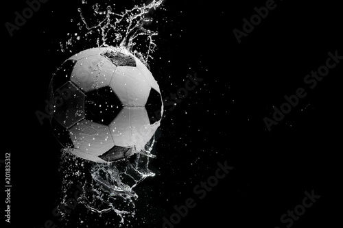 Soccer ball on the black background.