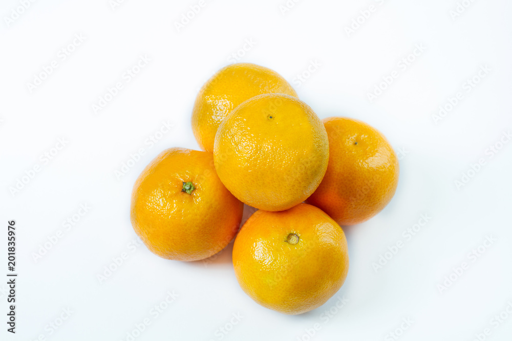 Copy space and mock up. Mandarin, tangerine citrus fruit isolated on white background. Copy space and mock up. Mandarin, tangerine citrus fruit isolated on white background.