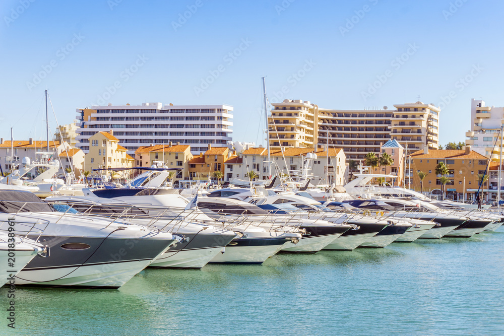 Marina full of luxurious yachts in touristic Vilamoura, Algarve, Portugal