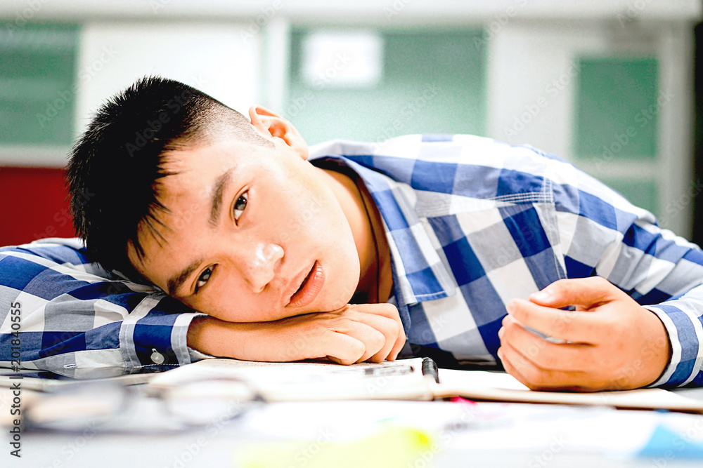 Male student study in the campus | Bored and tired of examination Male student study in the campus | Bored and tired of examination