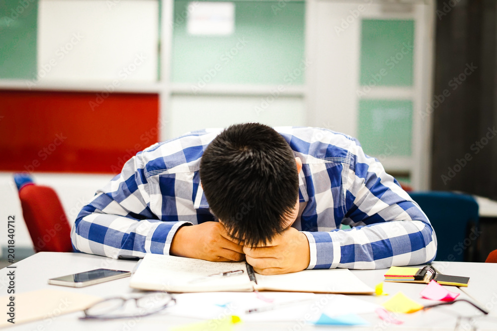 Male student study in the campus | Bored, sleepy and tired of examination Male student study in the campus | Bored, sleepy and tired of examination