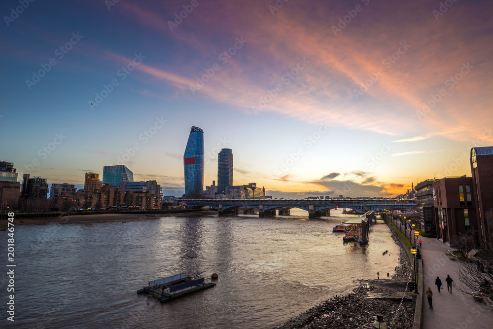 London, England - Beautiful sunset in London with skyscrapers and Blackfriars Bridge over River Thames