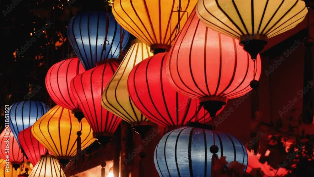 Night view of colorful lanterns swaying in wind at Hoian