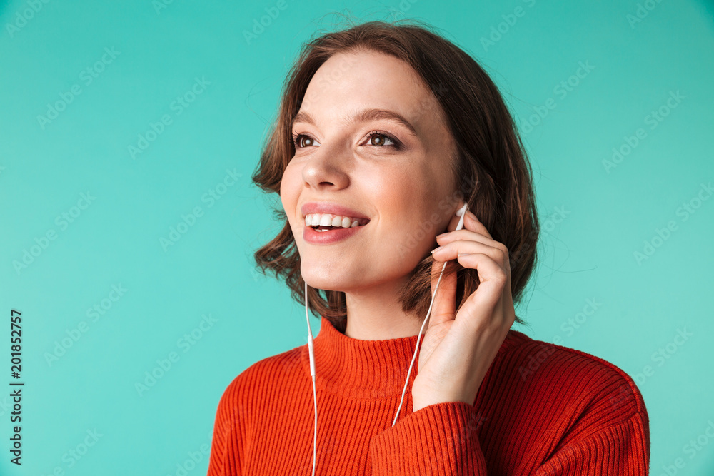 Portrait of a smiling young woman dressed in sweater Portrait of a smiling young woman dressed in sweater