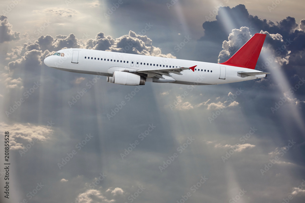 Fototapeta premium Commercial airplane flying above clouds.