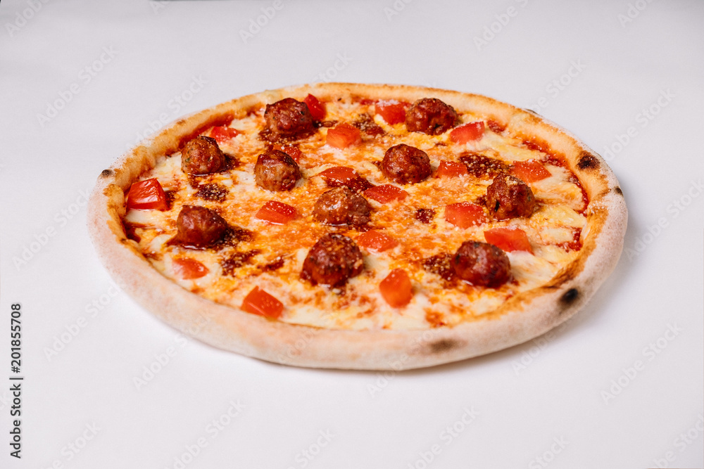 Pizza with meatballs and tomato isolated on white Pizza with meatballs and tomato isolated on white