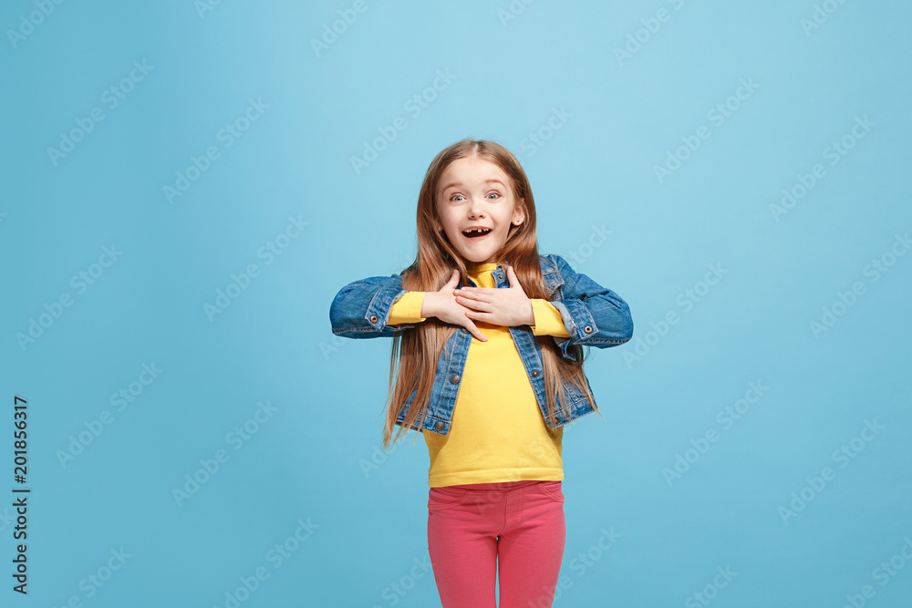 Beautiful teen girl looking suprised isolated on blue Beautiful teen girl looking suprised isolated on blue