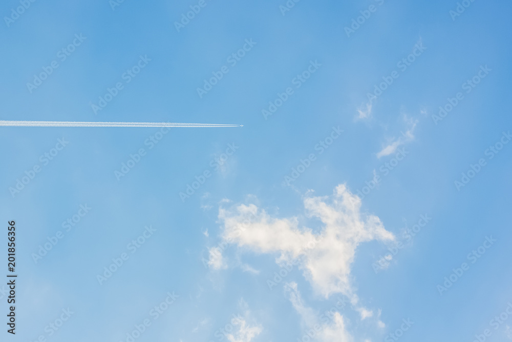 Blue sky with clouds and airplane track wallpaper background with empty space for copy or text Blue sky with clouds and airplane track wallpaper background with empty space for copy or text