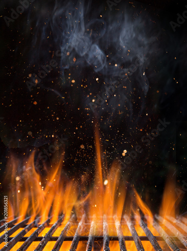 Empty flaming charcoal gril...