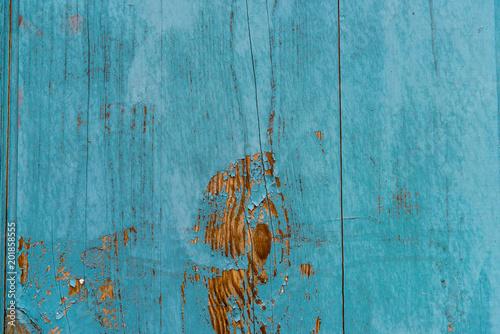 Wooden planks painted in blue background