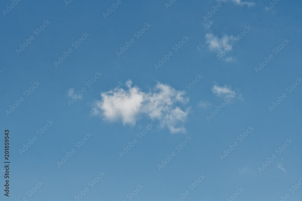 Clear blue sky with plain white cloud with space for text background Clear blue sky with plain white cloud with space for text background