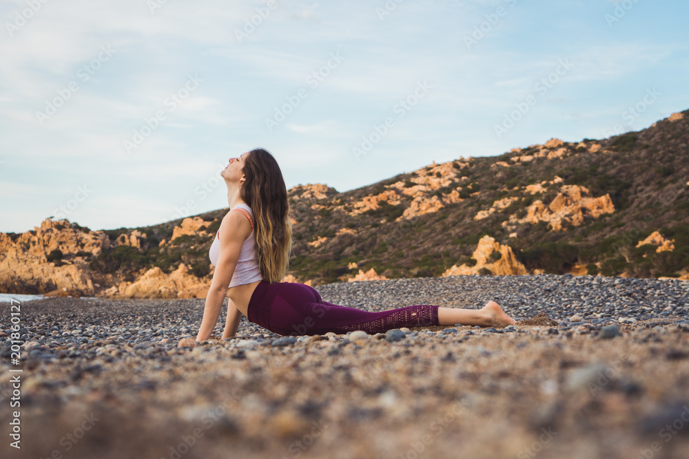 Woman exercising on beach Woman exercising on beach