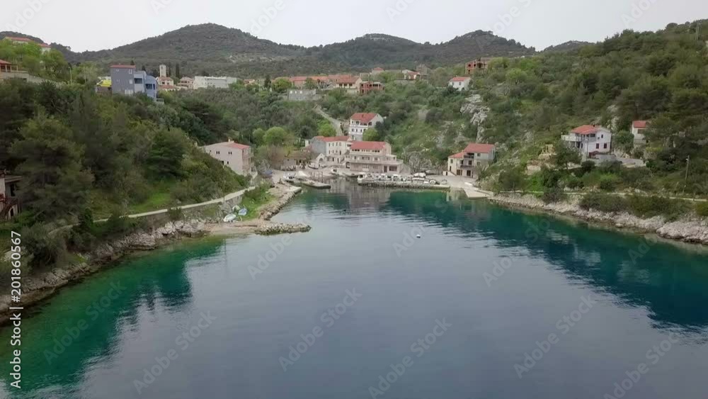 Aerial: Filming beautiful ble green bay with seagull flying in front. Filmed on sailing trip in Croatia on beautiful blue Adriatic sea. Aerial: Filming beautiful ble green bay with seagull flying in front. Filmed on sailing trip in Croatia on beautiful blue Adriatic sea.