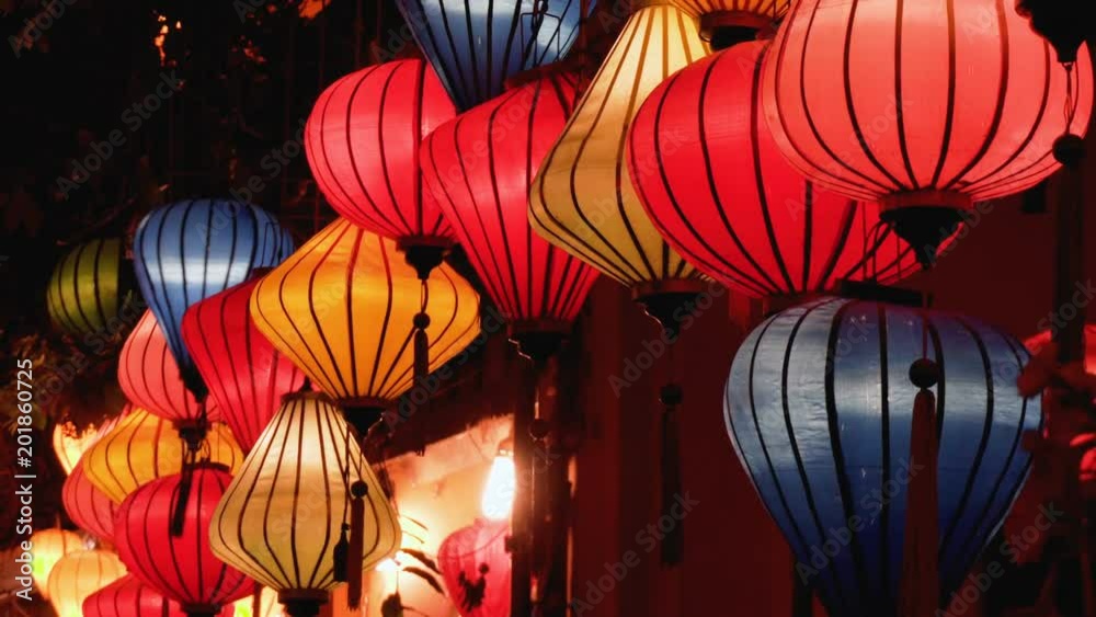 Night view of colorful lanterns swaying in wind at Hoian