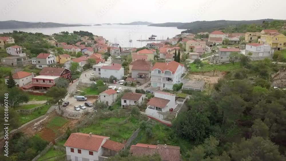 Aerial: Filming in back of village Sali on island Dugi otok in Croatia. Filming while turning drone arround towards mainland. Filmed on sailing trip in Croatia on beautiful blue Adriatic sea. Aerial: Filming in back of village Sali on island Dugi otok in Croatia. Filming while turning drone arround towards mainland. Filmed on sailing trip in Croatia on beautiful blue Adriatic sea.