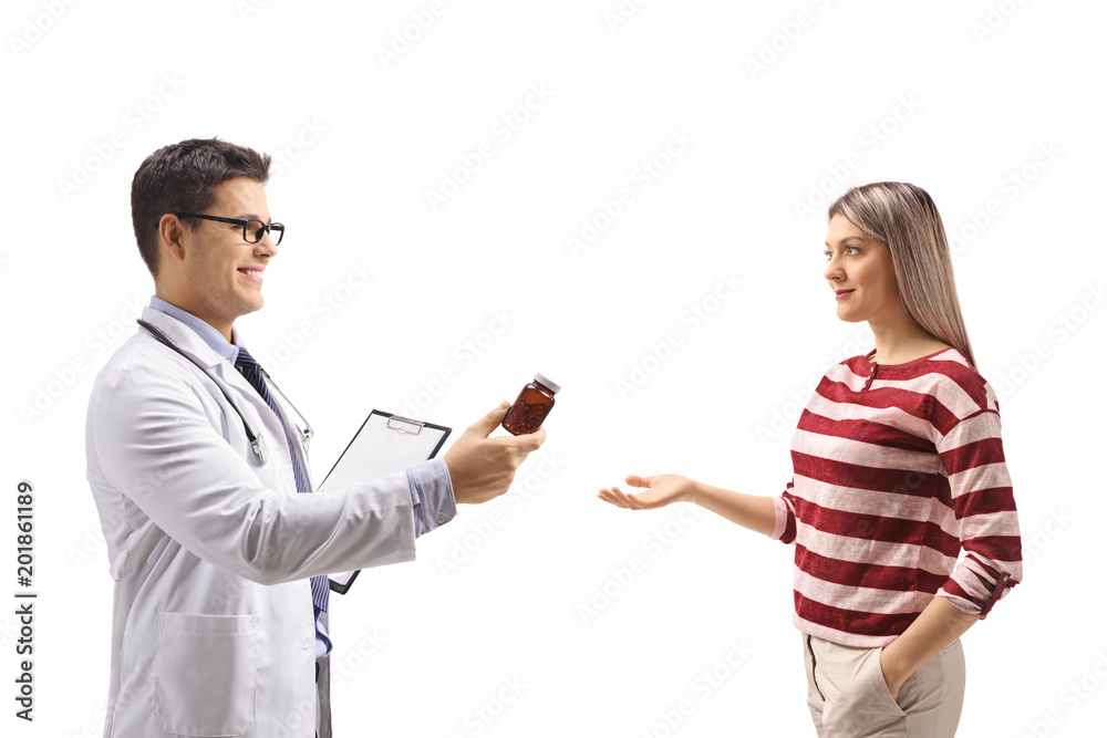Doctor giving a bottle of pills to a young woman Doctor giving a bottle of pills to a young woman