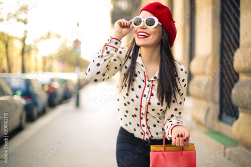Bilde på lerret Fashionable girl walking around the city with amazing clothes