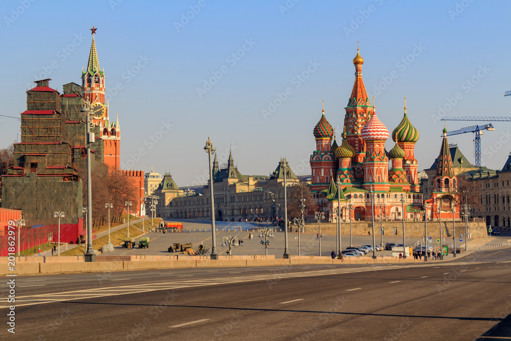 Moscow Kremlin and St. Basil's Cathedral on a sunny spring morning. View from the Bol'shoy Moskvoretskiy bridge