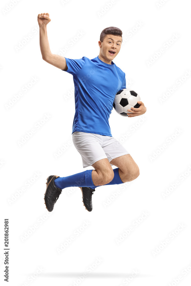 Overjoyed teenage soccer player jumping