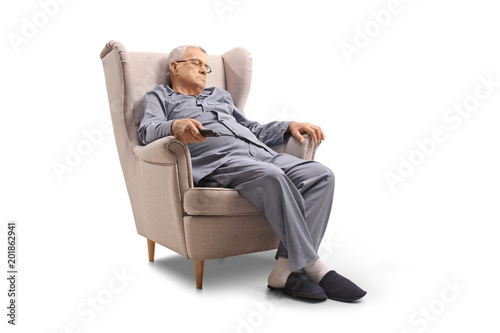 Mature man sleeping in an armchair