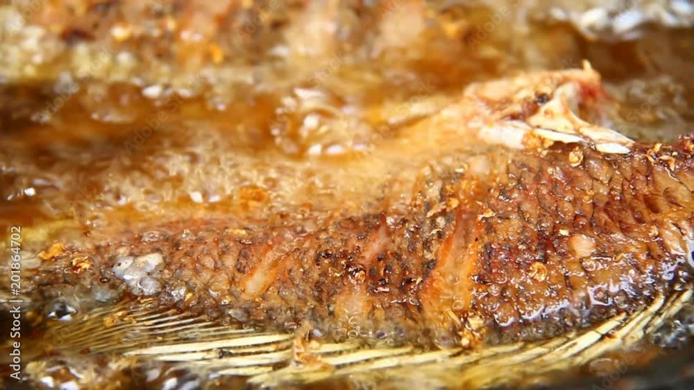 frying fish in pan frying fish in pan