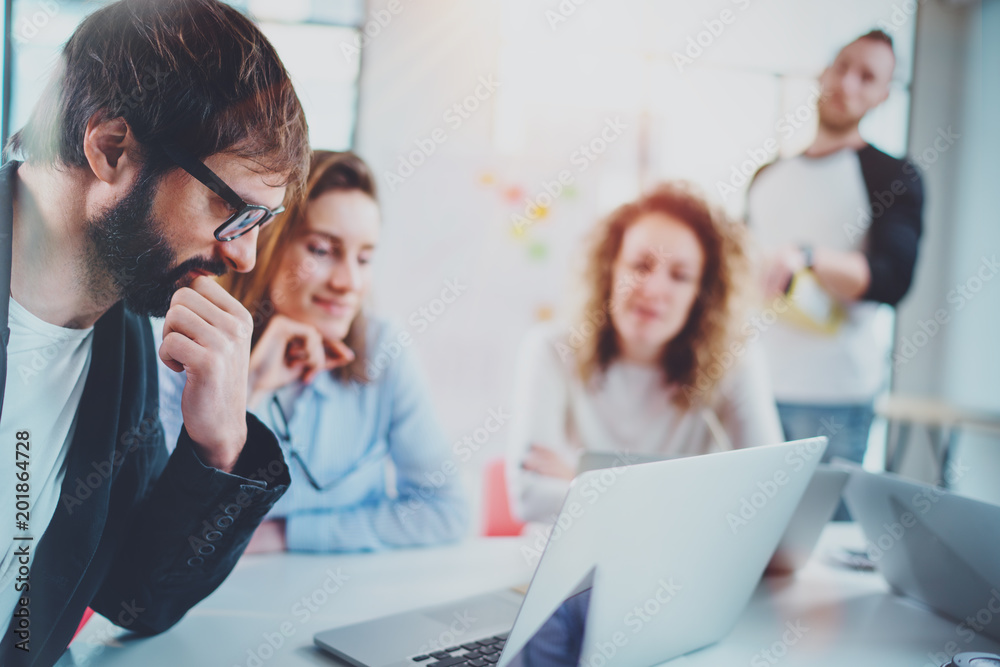 Business team making conversation at sunny meeting room.Horizontal.Blurred background. Business team making conversation at sunny meeting room.Horizontal.Blurred background.