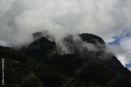 cold misty, foggy clouds on the mountains in the alps in Switzerland, Europe