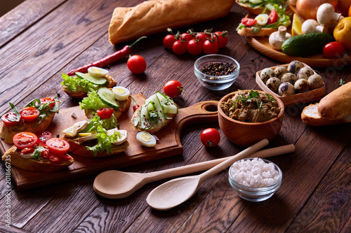 Breakfast still life with sandwiches, quail eggs, spicies and fresh fruits and vegetables, selective focus