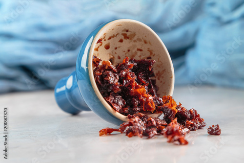 shisha with Apple flavor in glossy blue bowl, cooked for Smoking