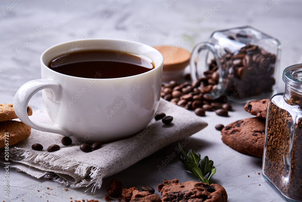 Breakfast background with mug of fresh coffee, homemade oatmeal cookies, grind coffee