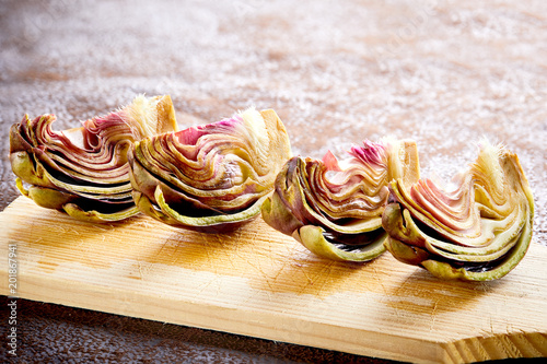 artichokes cut in four on dark background
