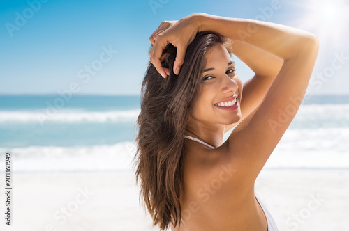 Beautiful woman on beach smiling