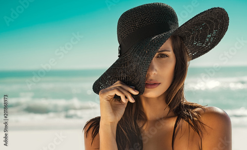 Fashion woman with straw hat at beach