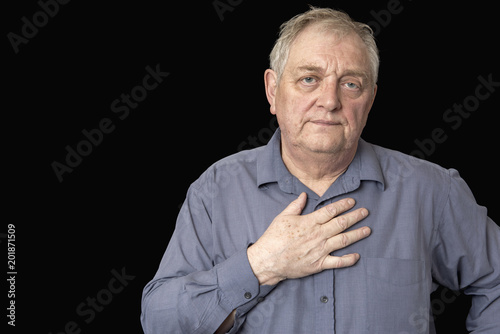Wallpaper Mural Portrait image of a mature Caucasian man looking tired and worried, on a black background  Torontodigital.ca