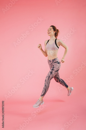 Young fitness sports woman running isolated