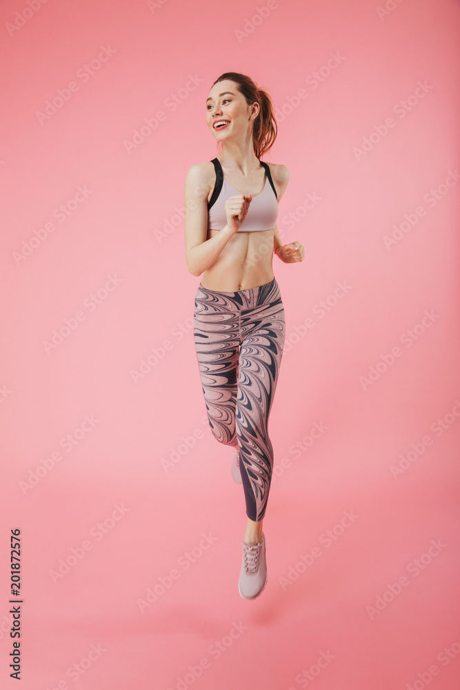 Happy young fitness sports woman running isolated Happy young fitness sports woman running isolated