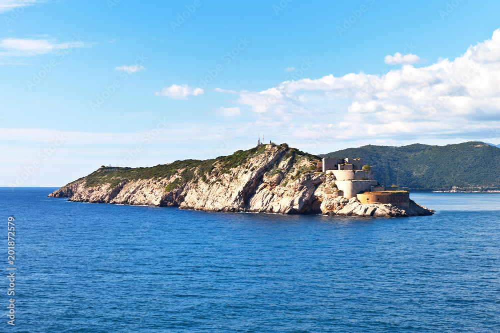 View from the water to the old Austro-Hungarian fortress Fort Ostro (Fort Sharp) on the Prevlaka peninsula at the entrance to the Boka Kotor Bay, the Adriatic Sea, Croatia