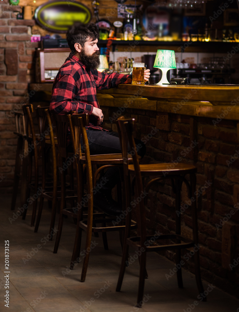 Guy spend leisure in bar, defocused background.