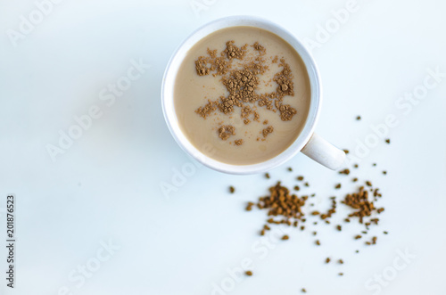 Cup of coffee on a white background, view from above