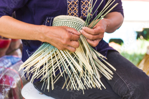 Motion image - The villagers took bamboo stripes to weave into different forms for daily use utensils of the community’s people in Bangkok Thailand, Thai handmade product.   photo