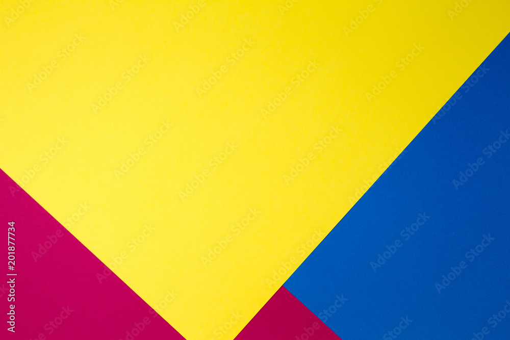 Color papers geometry flat composition background with yellow, red and blue tones