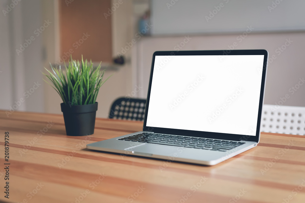 Laptop on table in office room background, for graphics display montage. Take your screen to put on advertising. Laptop on table in office room background, for graphics display montage. Take your screen to put on advertising.