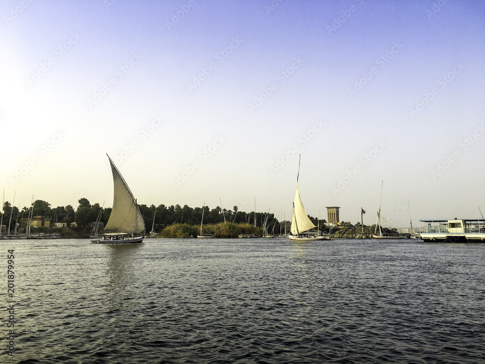 Obraz premium Scenic view of Nile River during sunset in Aswan Egypt
