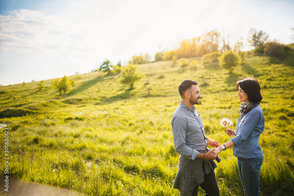 Couple walking hand in hand in park - Romantic date outdoors