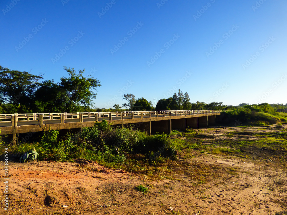 Bridge over Barragem Sanchuri (Sanchuri Dam) during dry season in Uruguaiana, Brazil