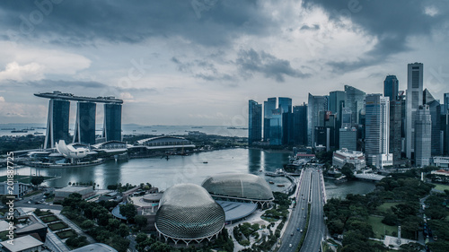 Aerial view panorama of Singapore skyscrapers with city skyline during cloudy summer day photo
