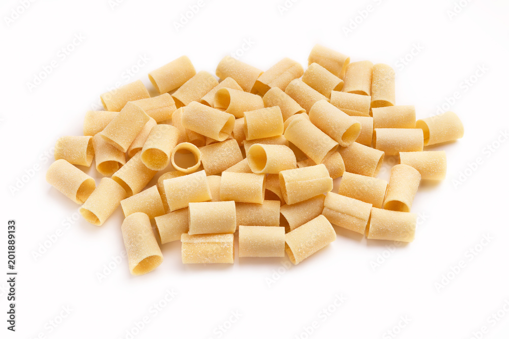 Pile of raw paccheri on white background Pile of raw paccheri on white background